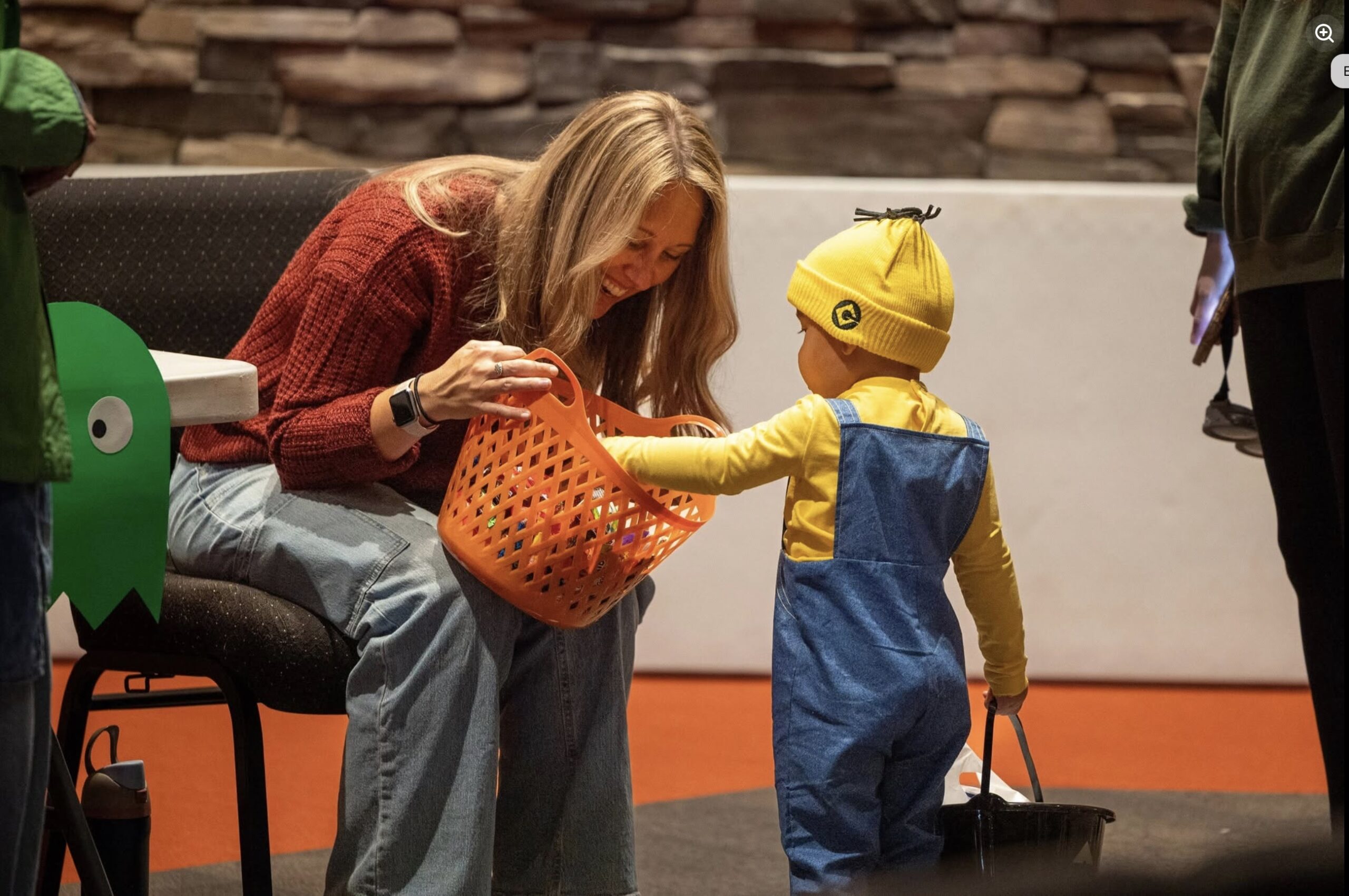 A child takes at treat at Waterville's 2025 Trunk or Treat celebration.