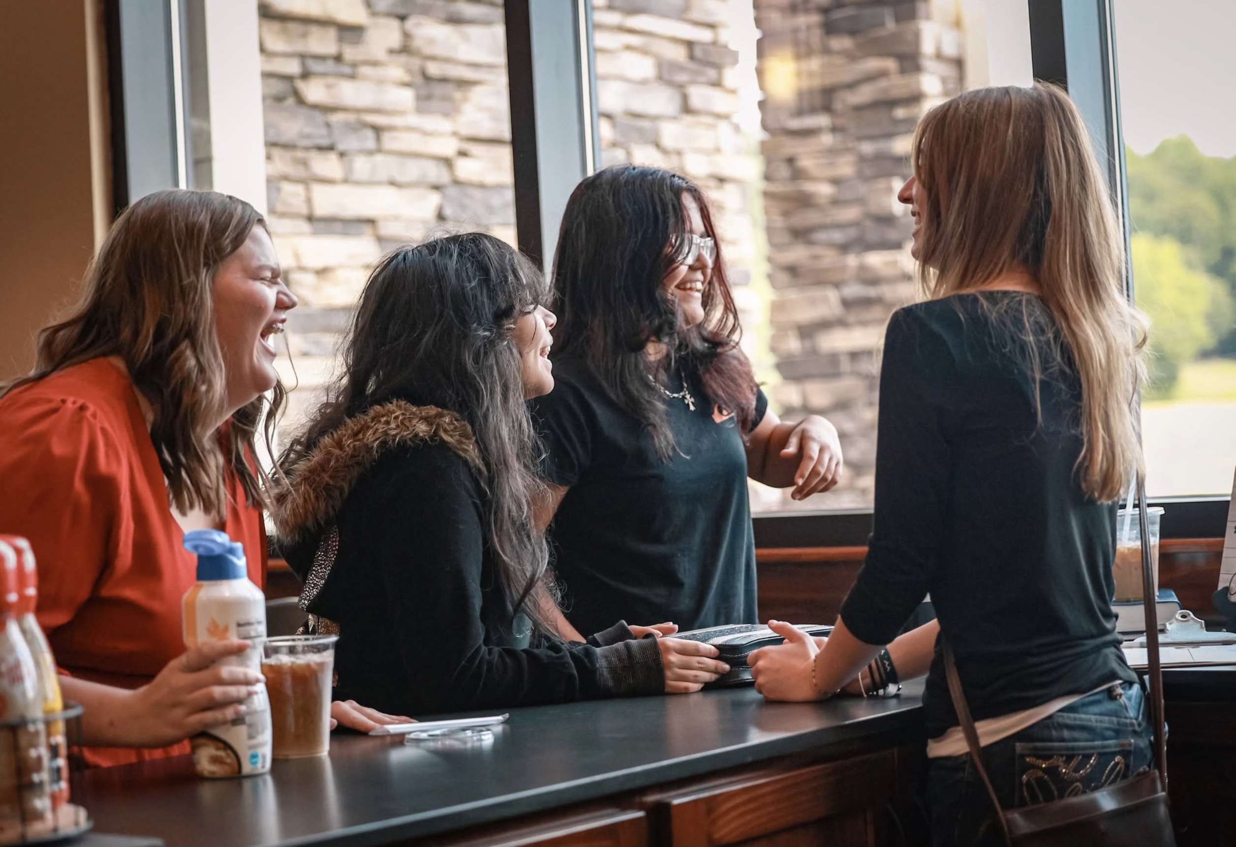 Churchgoers talk at a coffee bar.